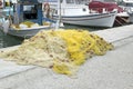 Yellow fishing nets on the shore of the port near the sea. Royalty Free Stock Photo