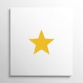 A yellow, five-pointed star is centered on a white square backgroun Royalty Free Stock Photo
