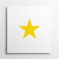 A yellow five pointed star is centrally positioned on a square white Royalty Free Stock Photo