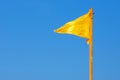 Yellow flag and blue sky Royalty Free Stock Photo