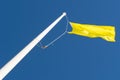 Yellow Flag and Blue Sky Royalty Free Stock Photo