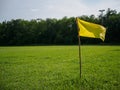 yellow flag at corner of soccer field. sport flag and sign concept. Royalty Free Stock Photo