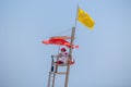 Yellow flag installed on top of lifeguard seat on the beach of Valencia Royalty Free Stock Photo