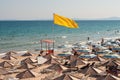 Yellow flag at the sea beach
