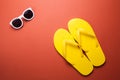 Yellow flip flops and sunglasses