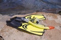 Yellow flippers and diving mask on the beach Royalty Free Stock Photo