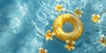 Yellow float ring and frangipani flowers floating on tranquil pool water, concept of summer relaxation and vacation. Royalty Free Stock Photo