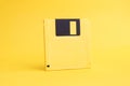 Yellow floppy disk 3.5 Inch on yellow background