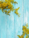 Yellow flowers autumn frame floral retro decoration blooming on a blue wooden background Royalty Free Stock Photo