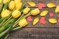 Yellow flowers seen from above. Lay flat on boards. Tulip petals with red hearts. Royalty Free Stock Photo
