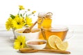 Yellow flowers, tea , lemon and honey