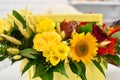 Yellow flowers in a wooden box composition on the table. fresh bright flowers bouquet gift Royalty Free Stock Photo
