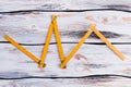 Yellow folding ruler on wooden background. Royalty Free Stock Photo