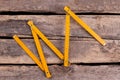 Yellow folding ruler on wooden boards background. Royalty Free Stock Photo