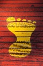 Yellow Footprint Against Red Background