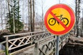 Yellow forbidden cycling road sign in Finland.