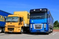 Yellow Ford Cargo 1830 and Renault Magnum Semi Trucks