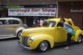 Yellow Ford 1940, and a woman with glasses