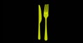 Yellow fork and spoon are rotating, isolated on black background. Loopable seamless video, 3D render. Concept of cutlery and kitch