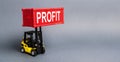 A yellow forklift lifts a red container labeled Profit. The concept of raising profits and income from successful investments