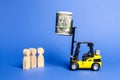 Yellow forklift raised to the height of the bundle of money unattainable for people below. Main prize, puzzle, contract. Royalty Free Stock Photo