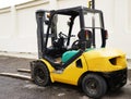 Yellow Forklift stands on a construction site Royalty Free Stock Photo
