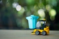 Yellow forklift toy load blue plastic garbage bin