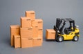 Yellow Forklift truck brings the box to a stack of boxes. Industry and Production. warehouses and transportation. raise economic