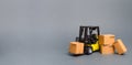 Yellow Forklift truck with cardboard boxes. Increase sales, production of goods. transportation, storage of cargo and goods Royalty Free Stock Photo