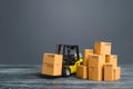 Yellow Forklift truck and cardboard boxes. Production, transport, cargo storage. Freight shipping. retail. Transportation