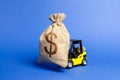 Yellow Forklift Truck Carries A Big Bag Of Money. Attracting Investment In The Development And Modernization Of Production And