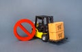 Yellow Forklift truck carries boxex and a red prohibition symbol NO. Embargo trade wars. Restriction on importation production Royalty Free Stock Photo