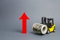 Yellow Forklift truck carries a large bundle of dollars and a big red arrow up. Growth of revenue and profit. development Royalty Free Stock Photo