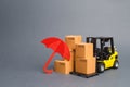 Yellow Forklift truck near carton boxes with a pattern of shopping carts and umbrella. insurance, providing warranty on purchased Royalty Free Stock Photo