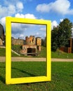 Yellow frame. Outdoor art object in front of the historic Vastseliina castle ruins, Voru, Estonia