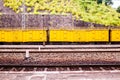 Yellow freight train box cars in perspective Royalty Free Stock Photo