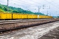 Yellow freight train box cars in perspective Royalty Free Stock Photo