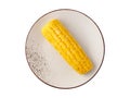 Yellow fresh boiled sweet corn cob on vintage plate isolated on white background. Royalty Free Stock Photo