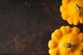 Yellow fresh pattypan squash at the right of the rusty metal background horizontal Royalty Free Stock Photo