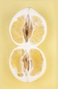 Yellow pomelo cut into two halves on yellow background Royalty Free Stock Photo