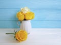 Yellow fresh rose vase vintage wooden background frame nature greeting decoration Royalty Free Stock Photo