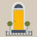 Yellow front door with plants in pots and cast iron fence