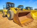 Yellow Front End Loader with rusted load bucket