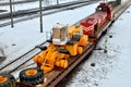 The yellow and front loader disassembled into parts is loaded onto a cargo railway platform Royalty Free Stock Photo