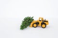 Yellow front loader truck with green tree isolate on white background Royalty Free Stock Photo