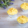 Yellow Frosted Cupcakes in Silver cupcake paper