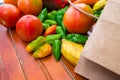 Yellow fruits and red, yellow and green vegetables on a wooden base. Healthy food. Multicoloured raw food