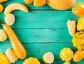 Yellow fruits and vegetables on a turquoise wooden background Royalty Free Stock Photo
