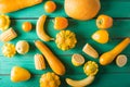 Yellow fruits and vegetables on a turquoise wooden background Royalty Free Stock Photo