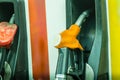 Yellow fuel oil dispenser at petrol filling station. Fuel dispensing pump at a gas station Royalty Free Stock Photo